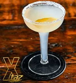 A Lemon Drop cocktail with a lemon twist