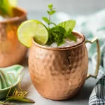 A Moscow Mule cocktail in a copper mug
