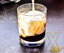 A White Russian cocktail in a chilled glass